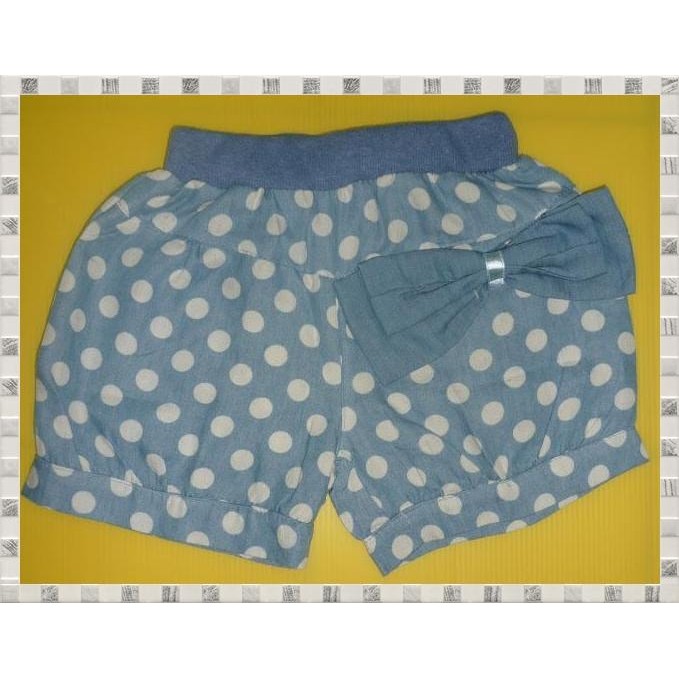 Bermuda Pants features an elastic waistline with polka dots prints and a bow.